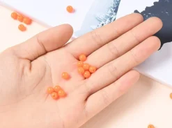 100 perles en plastique rondes 6 mm - orange fluo