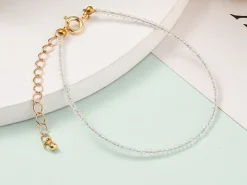 Bracelet en perles facétées - blanc irisé